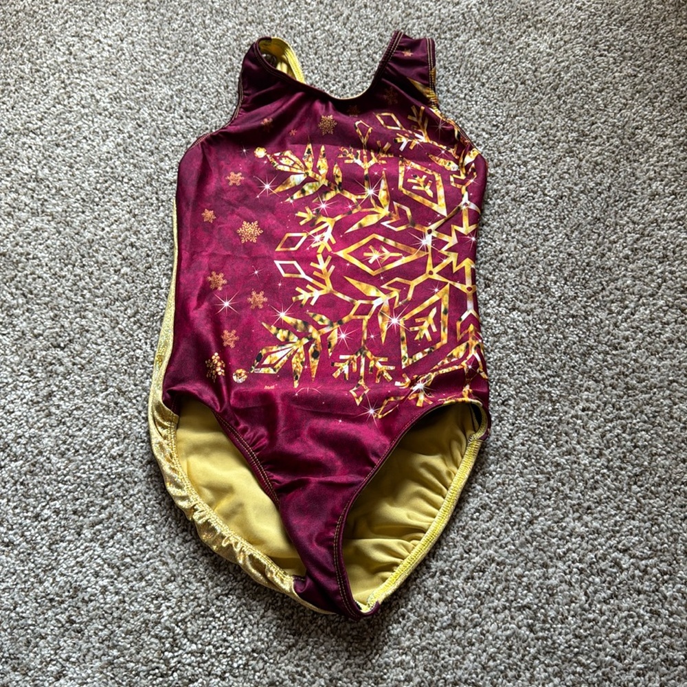 Elegant, gold, and red snowflake leotard by snowflake